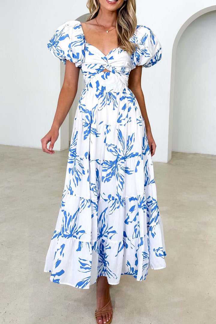 Renske – Gebloemde Midi Jurk met Pofmouwen en Cut-out Detail