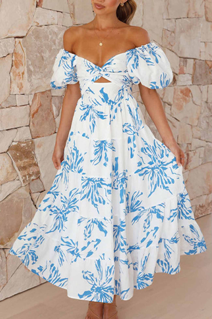 Renske – Gebloemde Midi Jurk met Pofmouwen en Cut-out Detail