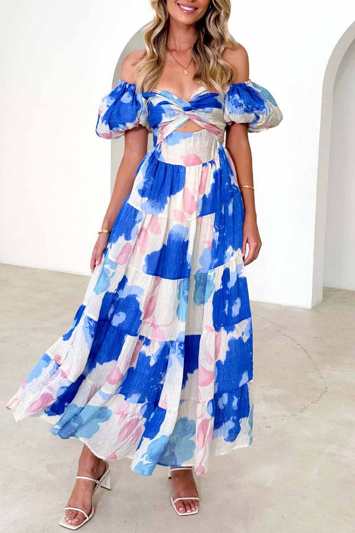 Renske – Gebloemde Midi Jurk met Pofmouwen en Cut-out Detail