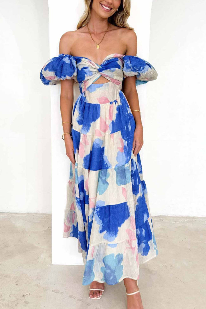 Renske – Gebloemde Midi Jurk met Pofmouwen en Cut-out Detail