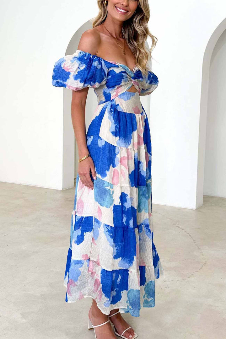 Renske – Gebloemde Midi Jurk met Pofmouwen en Cut-out Detail