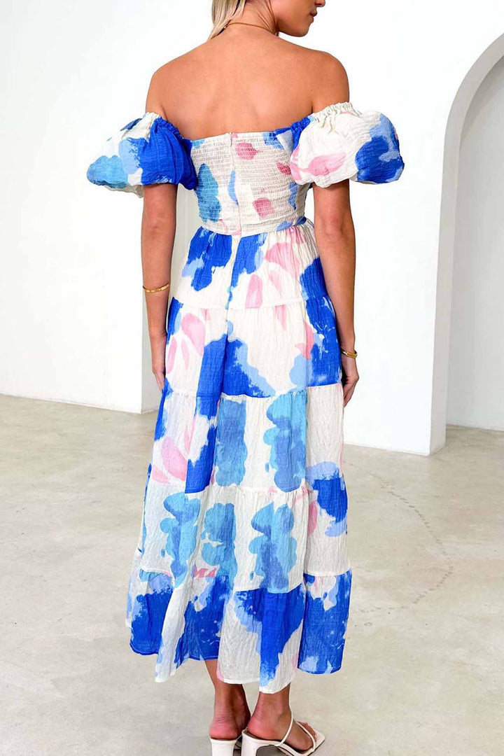 Renske – Gebloemde Midi Jurk met Pofmouwen en Cut-out Detail