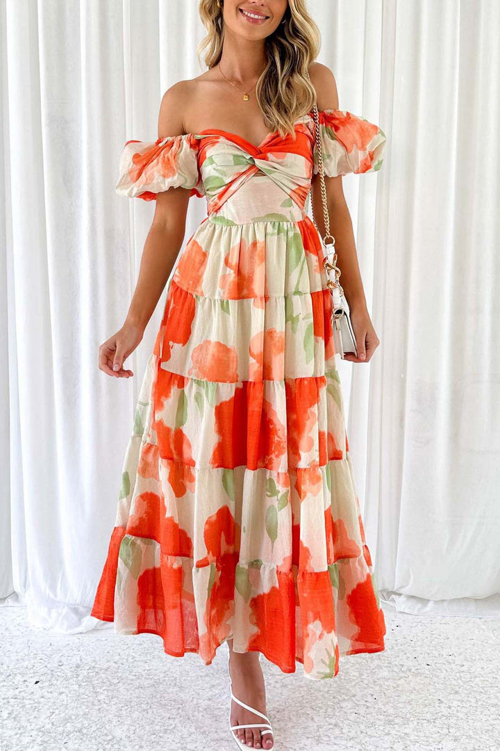 Renske – Gebloemde Midi Jurk met Pofmouwen en Cut-out Detail