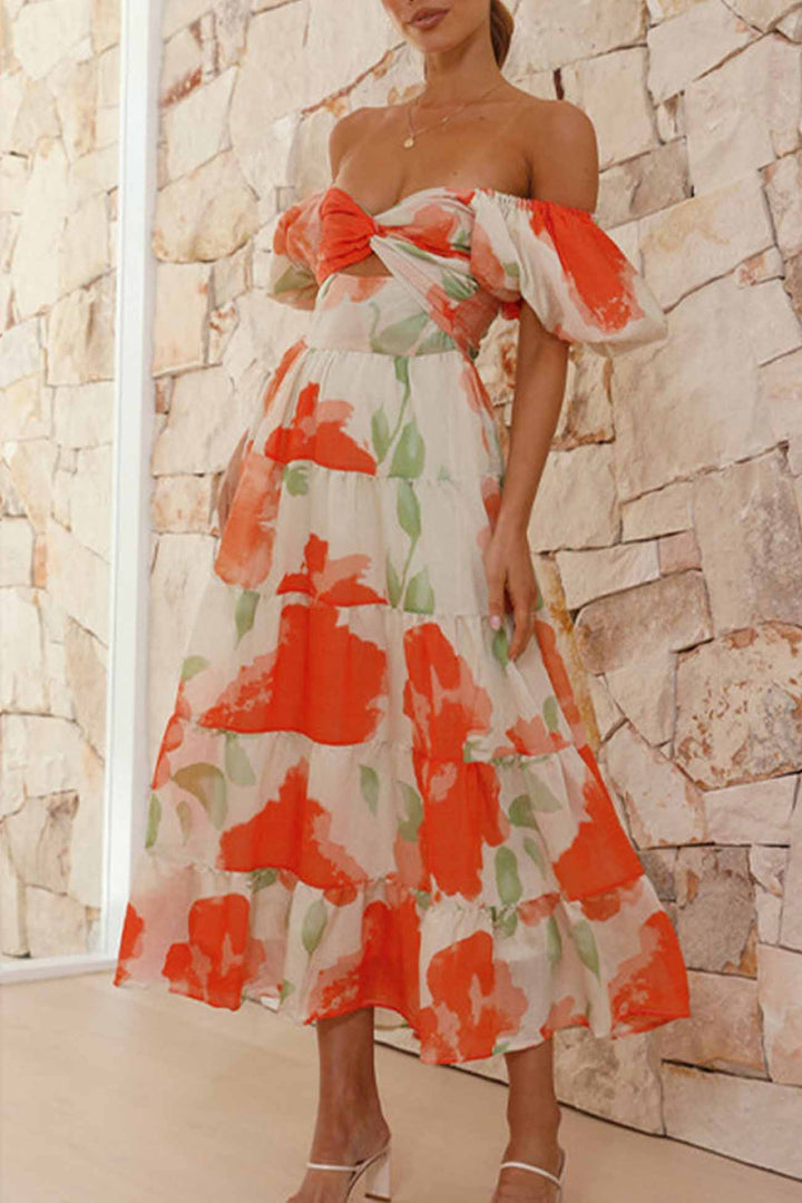 Renske – Gebloemde Midi Jurk met Pofmouwen en Cut-out Detail