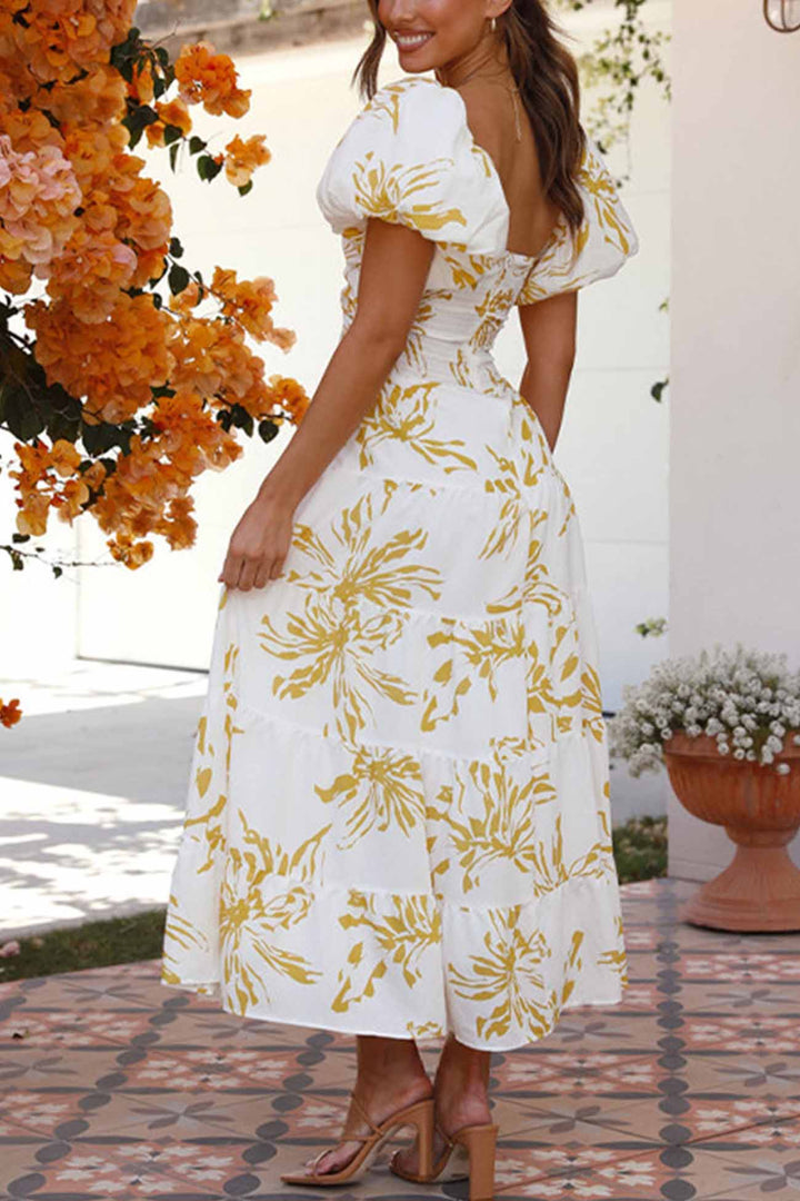 Renske – Gebloemde Midi Jurk met Pofmouwen en Cut-out Detail