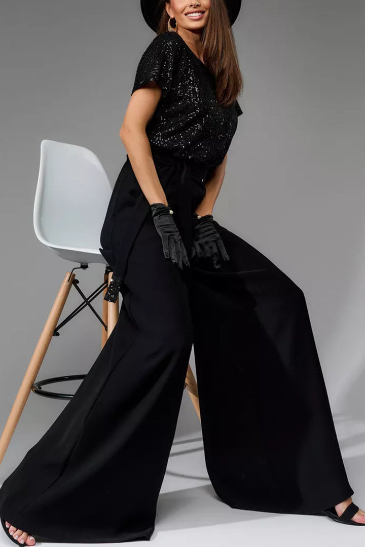 Nina – Jumpsuit met Pailletten en Open Rug