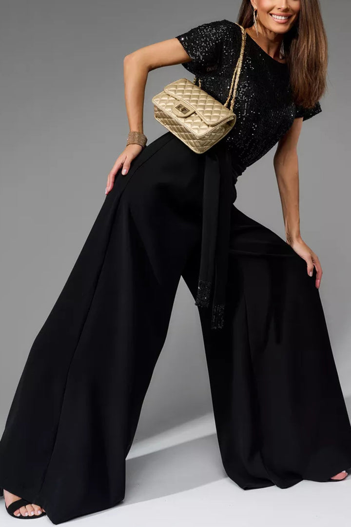Nina – Jumpsuit met Pailletten en Open Rug