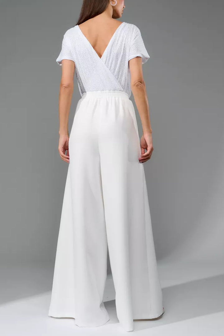 Nina – Jumpsuit met Pailletten en Open Rug