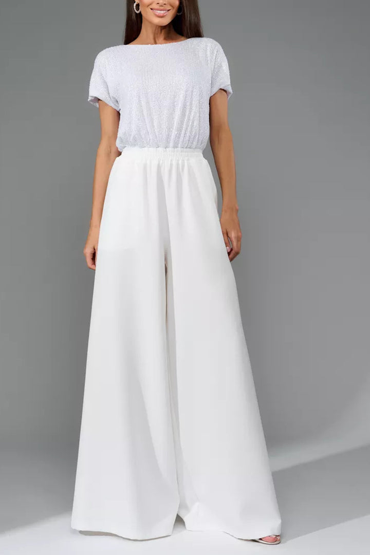 Nina – Jumpsuit met Pailletten en Open Rug