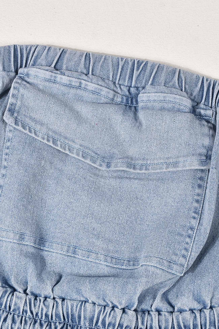 Tessa – Strapless Denim Jumpsuit met Grote Zak en Open Rug