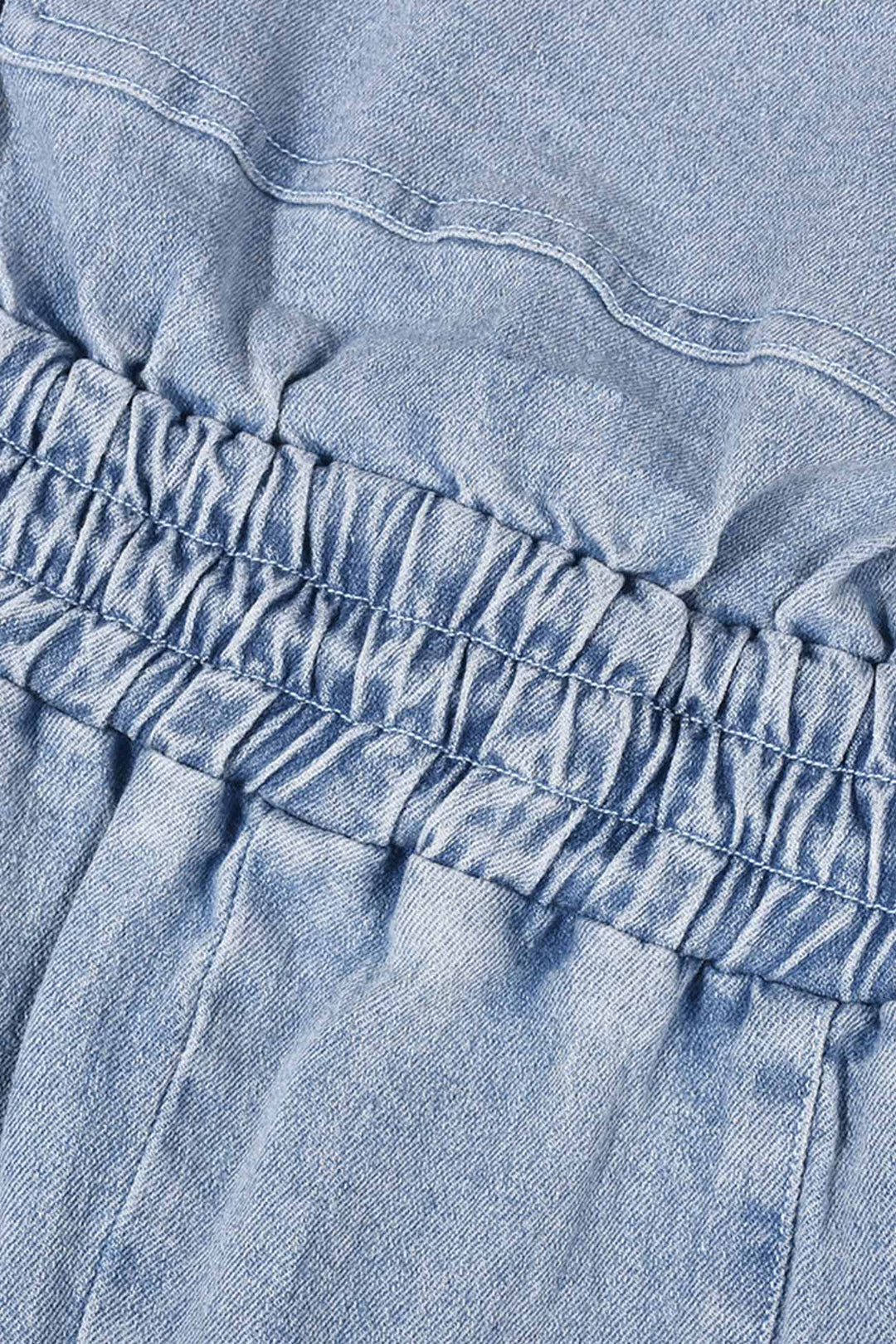 Tessa – Strapless Denim Jumpsuit met Grote Zak en Open Rug