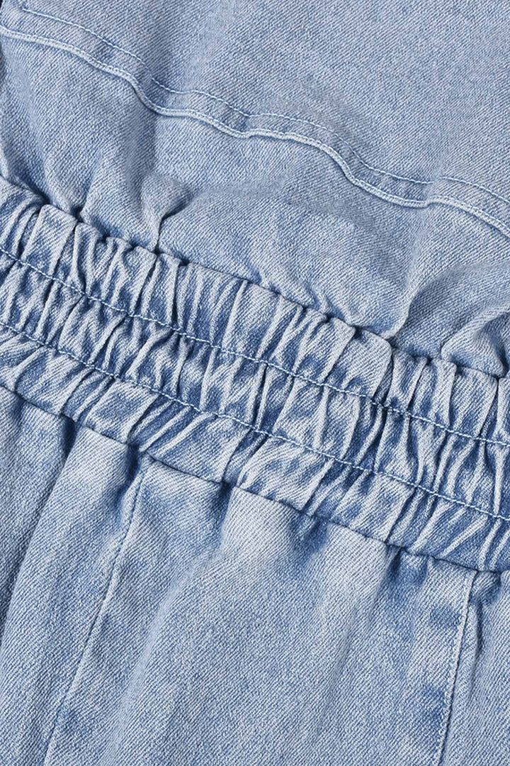 Tessa – Strapless Denim Jumpsuit met Grote Zak en Open Rug