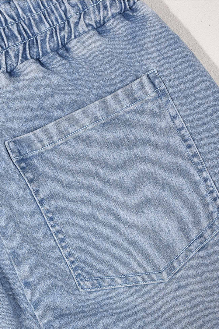 Tessa – Strapless Denim Jumpsuit met Grote Zak en Open Rug