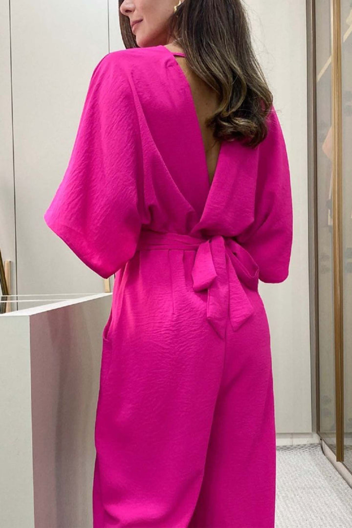 Mila – Jumpsuit met V-Hals, Vleermuismouwen en Open Rug