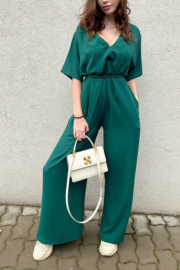 Sanne – Jumpsuit met V-Hals, Strikceintuur en Wijde Pijpen
