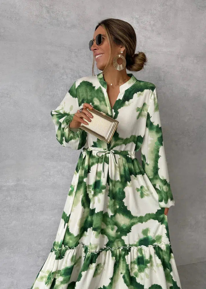 Lange damesjurk met lange mouwen, V-hals en elegante, vloeiende pasvorm