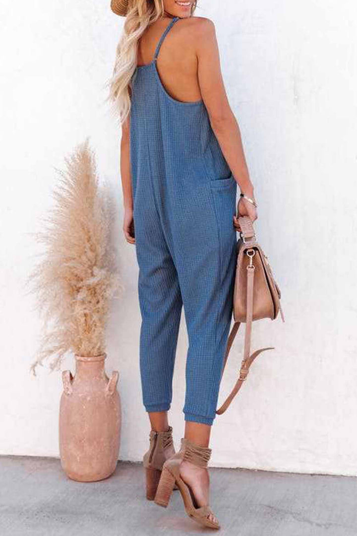 Linde – Wafelstructuur Jumpsuit met Spaghettibandjes en Diepe V-Hals