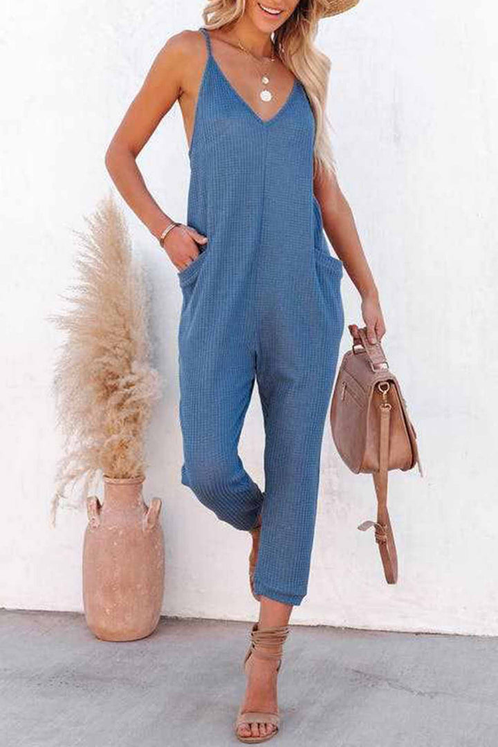 Linde – Wafelstructuur Jumpsuit met Spaghettibandjes en Diepe V-Hals